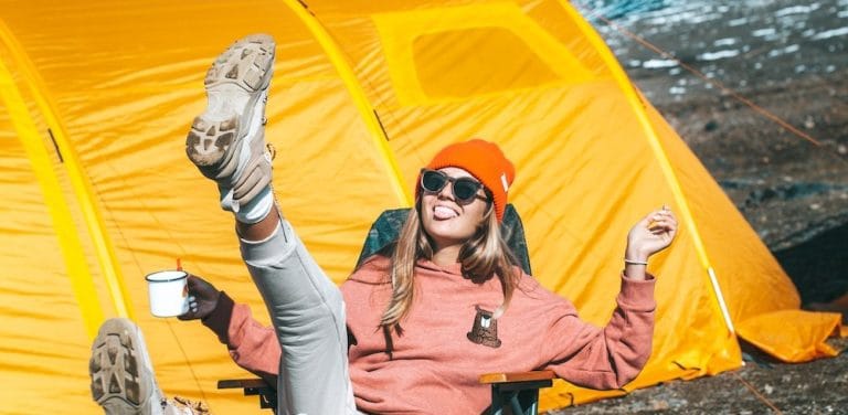 woman siting before her tent